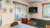 TV a/nebo společenská místnost v ubytování Holiday House Mária