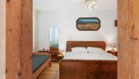Postel nebo postele na pokoji v ubytování Holiday House Mária