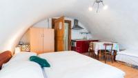 Postel nebo postele na pokoji v ubytování Holiday House Mária