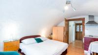 Postel nebo postele na pokoji v ubytování Holiday House Mária