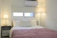 Posteľ alebo postele v izbe v ubytovaní Maria Central Cozy House