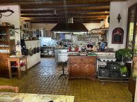 a large kitchen with a lot of appliances at Fattoria Raffaelli in Colle Farnese
