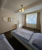 Postel nebo postele na pokoji v ubytování Rodinný apartmán U Kuby