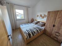 Łóżko lub łóżka w pokoju w obiekcie Apartments in Krk