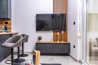 Televízia a/alebo spoločenská miestnosť v ubytovaní Apartments Bubalo