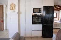 A kitchen or kitchenette at Michalis Apartment with Outdoor Jacuzzi