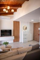 A television and/or entertainment centre at Michalis Apartment with Outdoor Jacuzzi