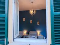 A bed or beds in a room at CASA MAFALDA - Rooms, friends and more - Affittacamere, Guest House