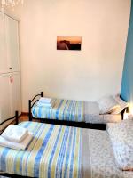 A bed or beds in a room at CASA MAFALDA - Rooms, friends and more - Affittacamere, Guest House