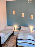A bed or beds in a room at CASA MAFALDA - Rooms, friends and more - Affittacamere, Guest House