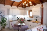 A kitchen or kitchenette at Michalis Apartment with Outdoor Jacuzzi