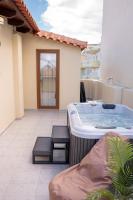 A seating area at Michalis Apartment with Outdoor Jacuzzi