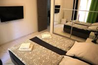 Televízia a/alebo spoločenská miestnosť v ubytovaní Laura Aristotelous Square Apartment