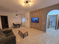 Televízia a/alebo spoločenská miestnosť v ubytovaní Apartamentos Casa Sardina