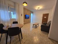 Televízia a/alebo spoločenská miestnosť v ubytovaní Apartamentos Casa Sardina