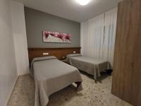 Posteľ alebo postele v izbe v ubytovaní Apartamentos Casa Sardina