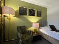 Posteľ alebo postele v izbe v ubytovaní Hotel Zlatý Býk