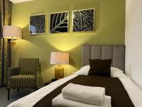 Posteľ alebo postele v izbe v ubytovaní Hotel Zlatý Býk