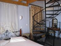 A bed or beds in a room at 9 Musses ROOMS-studios