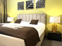 Posteľ alebo postele v izbe v ubytovaní Hotel Zlatý Býk