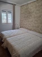 A bed or beds in a room at Casa La Sinagoga de Trujillo