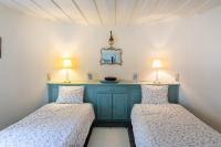 A bed or beds in a room at Authentic Cretan Stone Windmill