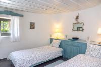 A bed or beds in a room at Authentic Cretan Stone Windmill