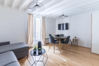 Telewizja i/lub zestaw kina domowego w obiekcie Home Suite Home Grands Boulevards 41