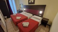 Posteľ alebo postele v izbe v ubytovaní Hotel Alibi