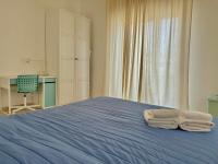 Postel nebo postele na pokoji v ubytování Appartamento Villa Circe