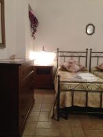 A bed or beds in a room at Podere Poggio Benedetto