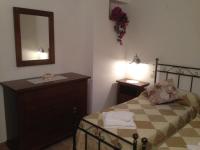 A bed or beds in a room at Podere Poggio Benedetto