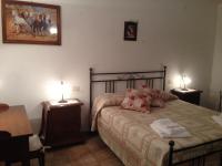 A bed or beds in a room at Podere Poggio Benedetto