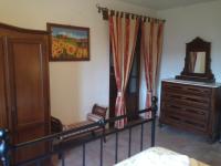 A bed or beds in a room at Podere Poggio Benedetto