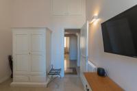 A television and/or entertainment centre at Vintage Ottaviano Apartment