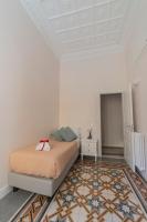 A bed or beds in a room at Vintage Ottaviano Apartment