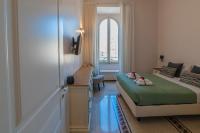 A bed or beds in a room at Vintage Ottaviano Apartment