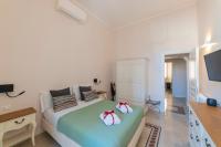 A bed or beds in a room at Vintage Ottaviano Apartment