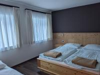 Posteľ alebo postele v izbe v ubytovaní Appartamenti Elbrus