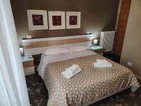 Posteľ alebo postele v izbe v ubytovaní B&B Lucana 22
