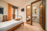 Posteľ alebo postele v izbe v ubytovaní Hotel Oasi Verde