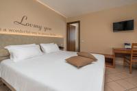 Posteľ alebo postele v izbe v ubytovaní Hotel Oasi Verde