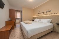 Posteľ alebo postele v izbe v ubytovaní Hotel Oasi Verde
