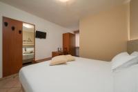 Posteľ alebo postele v izbe v ubytovaní Hotel Oasi Verde