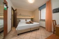 Posteľ alebo postele v izbe v ubytovaní Hotel Oasi Verde
