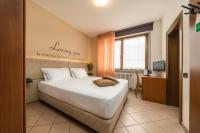 Posteľ alebo postele v izbe v ubytovaní Hotel Oasi Verde