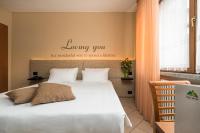 Posteľ alebo postele v izbe v ubytovaní Hotel Oasi Verde