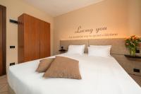 Posteľ alebo postele v izbe v ubytovaní Hotel Oasi Verde