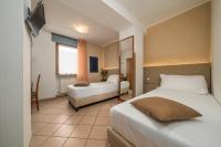 Posteľ alebo postele v izbe v ubytovaní Hotel Oasi Verde