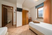 Posteľ alebo postele v izbe v ubytovaní Hotel Oasi Verde